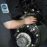 technician servicing brakes