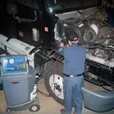 man doing truck maintenance