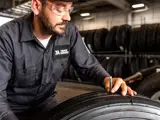 technician and tire tread