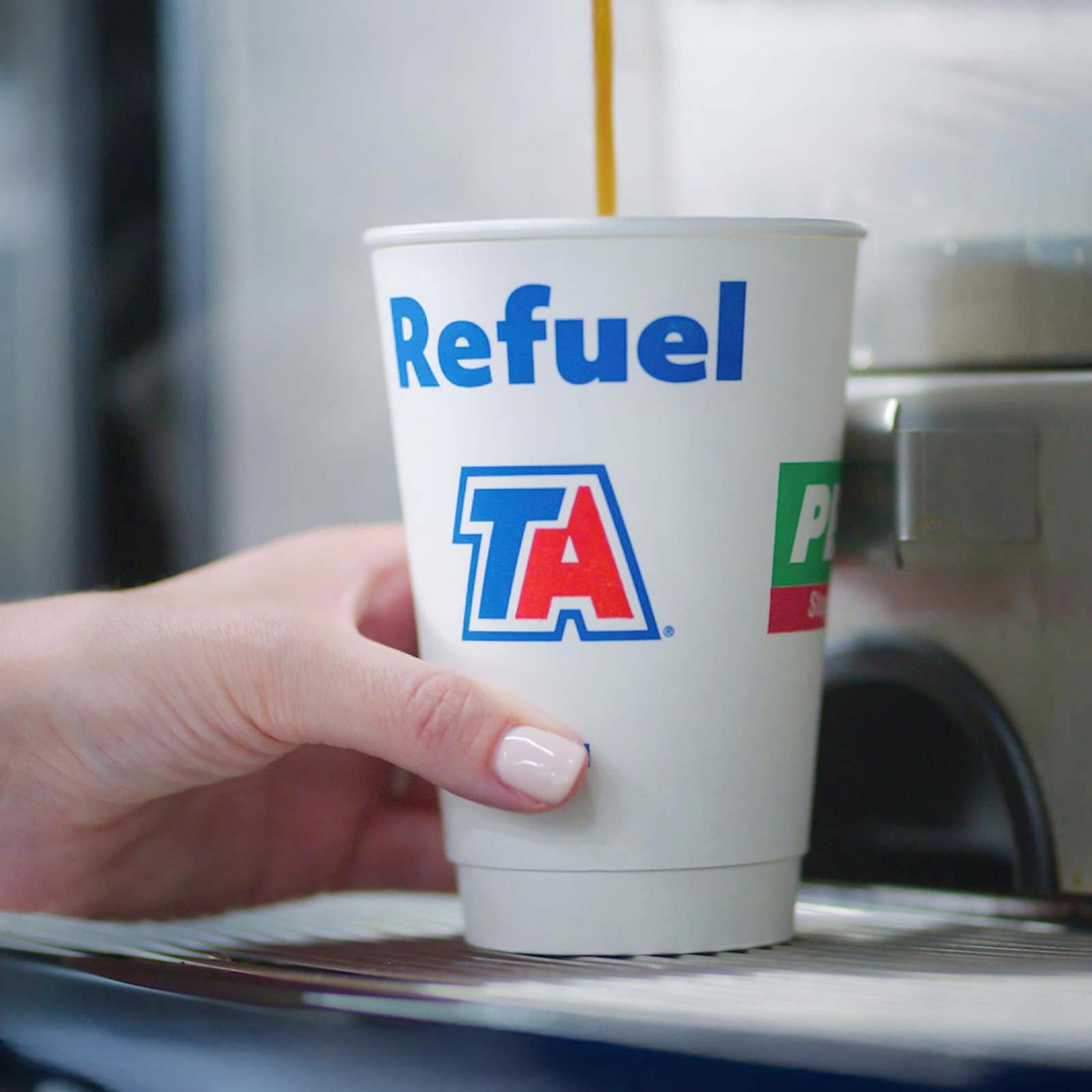 Dispensing hot coffee into a TA cup